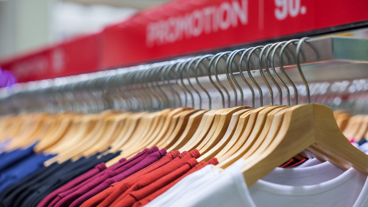 T-shirts on a clothing rack.