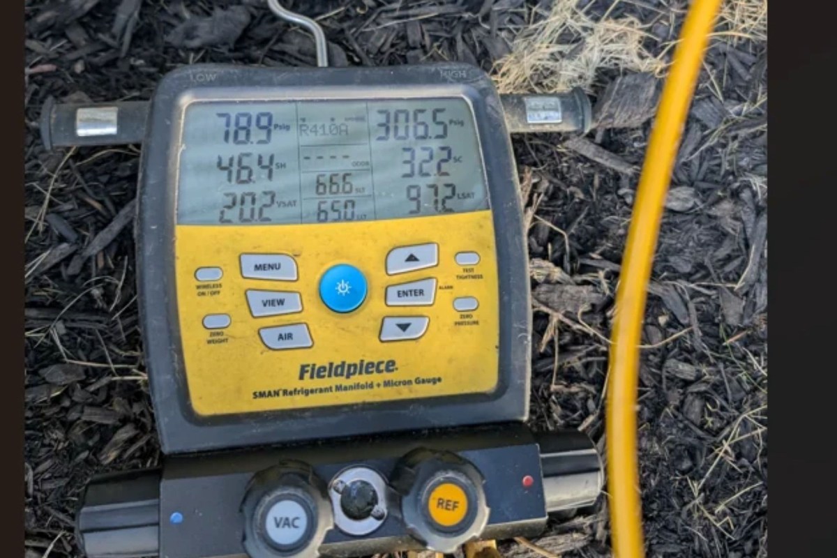 A tech's reading for an AC unit.