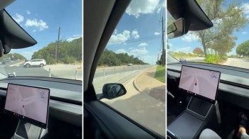 A view from inside a car showing the dashboard with navigation and the road ahead.
