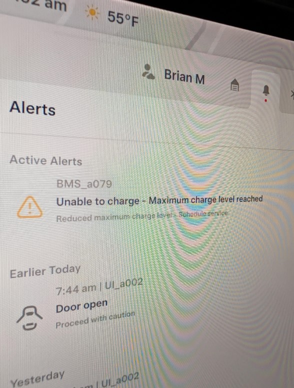 An app screen showing a Tesla is unable to charge.