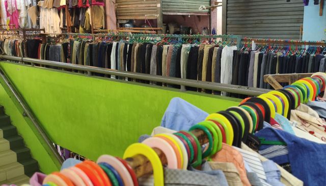 Clothes at a mall thrift store.