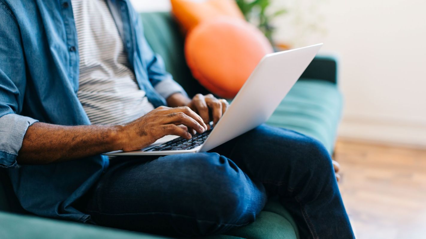 A person typing on a laptop.
