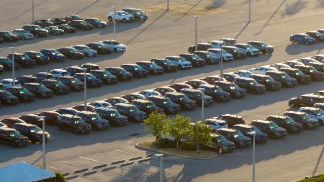 A large parking lot filled with cars.