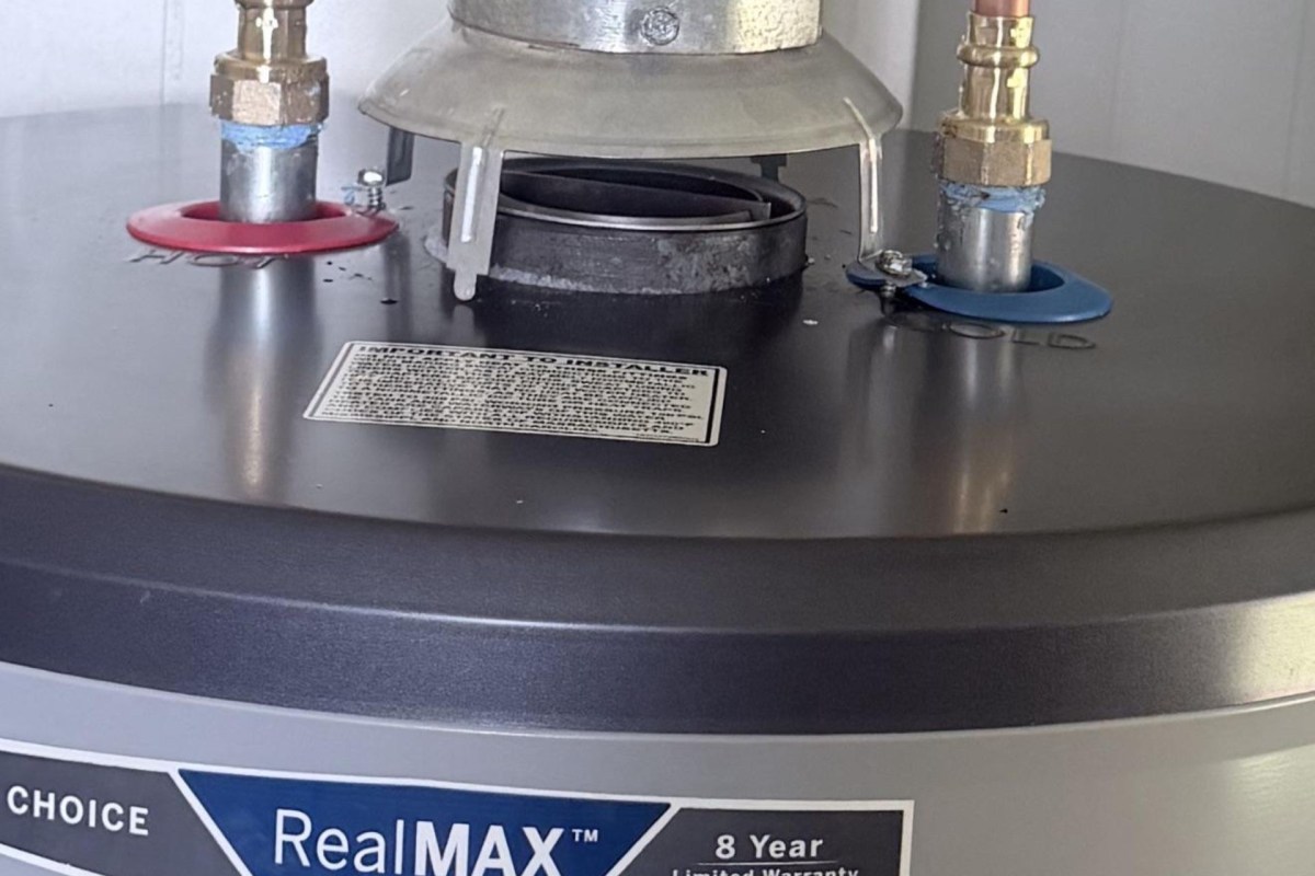 A vent pipe on a gas-vented water heater.