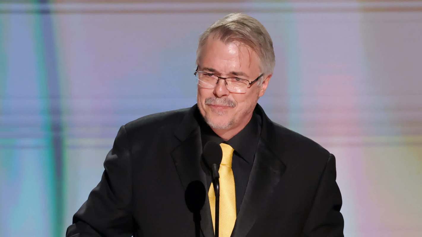 Vince Gilligan stands at a podium with a microphone.