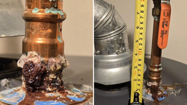 Water heater pipes with corrosion and a measuring tape