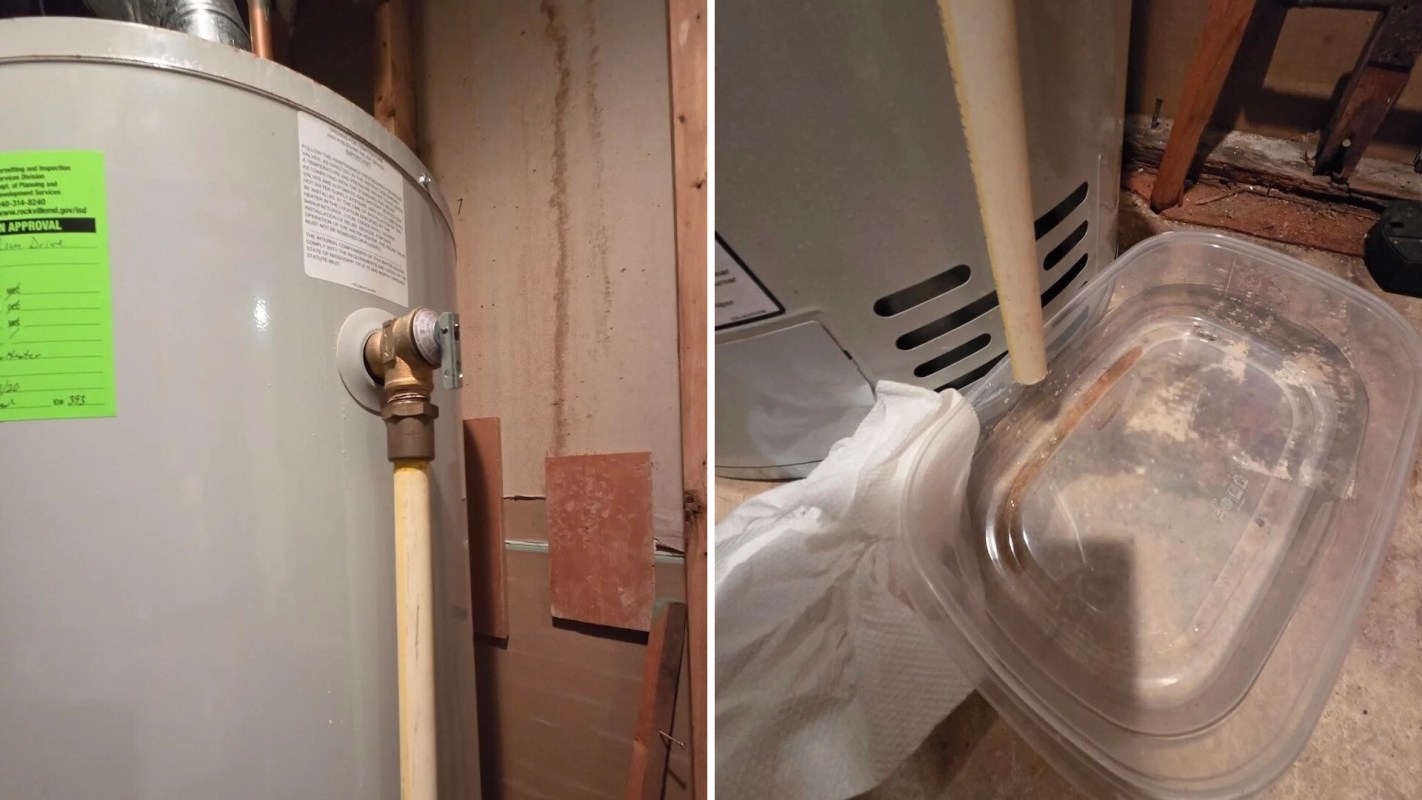 A hot water heater with a yellow pipe draining into a plastic container on the floor.