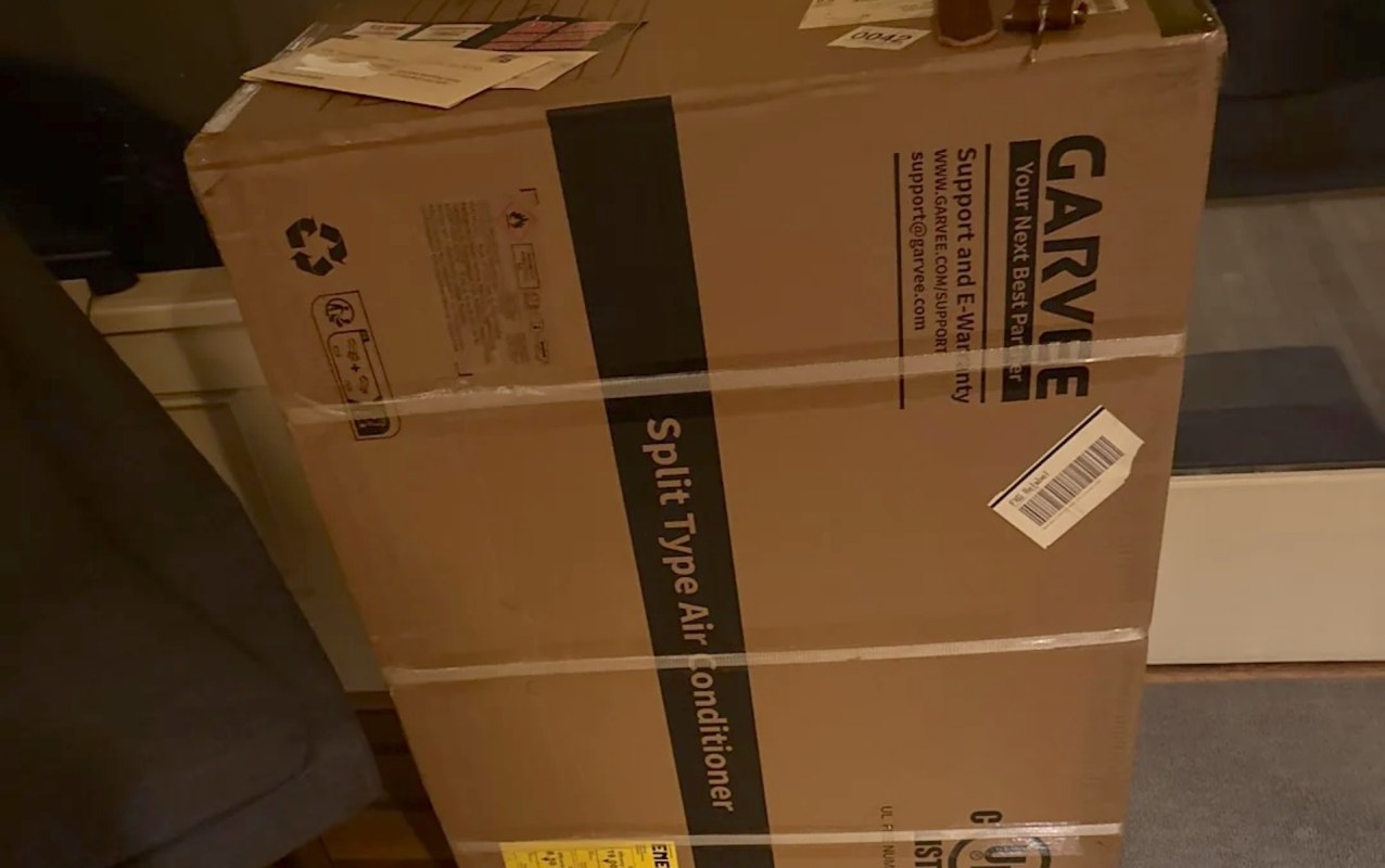 A large box labeled as a split type air conditioner.