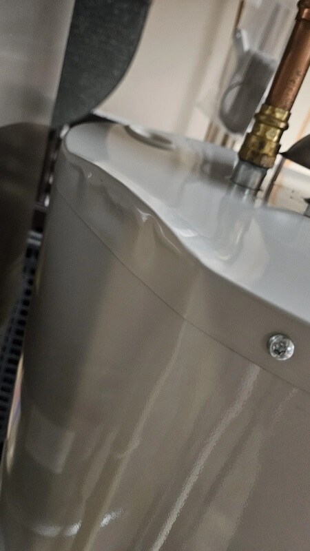 A dented water heater.