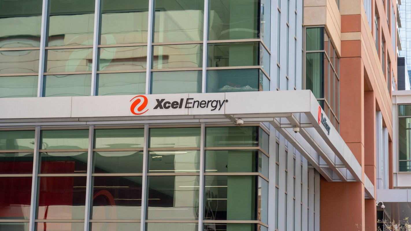 The exterior of an Xcel Energy office building with large windows and a prominent company sign.