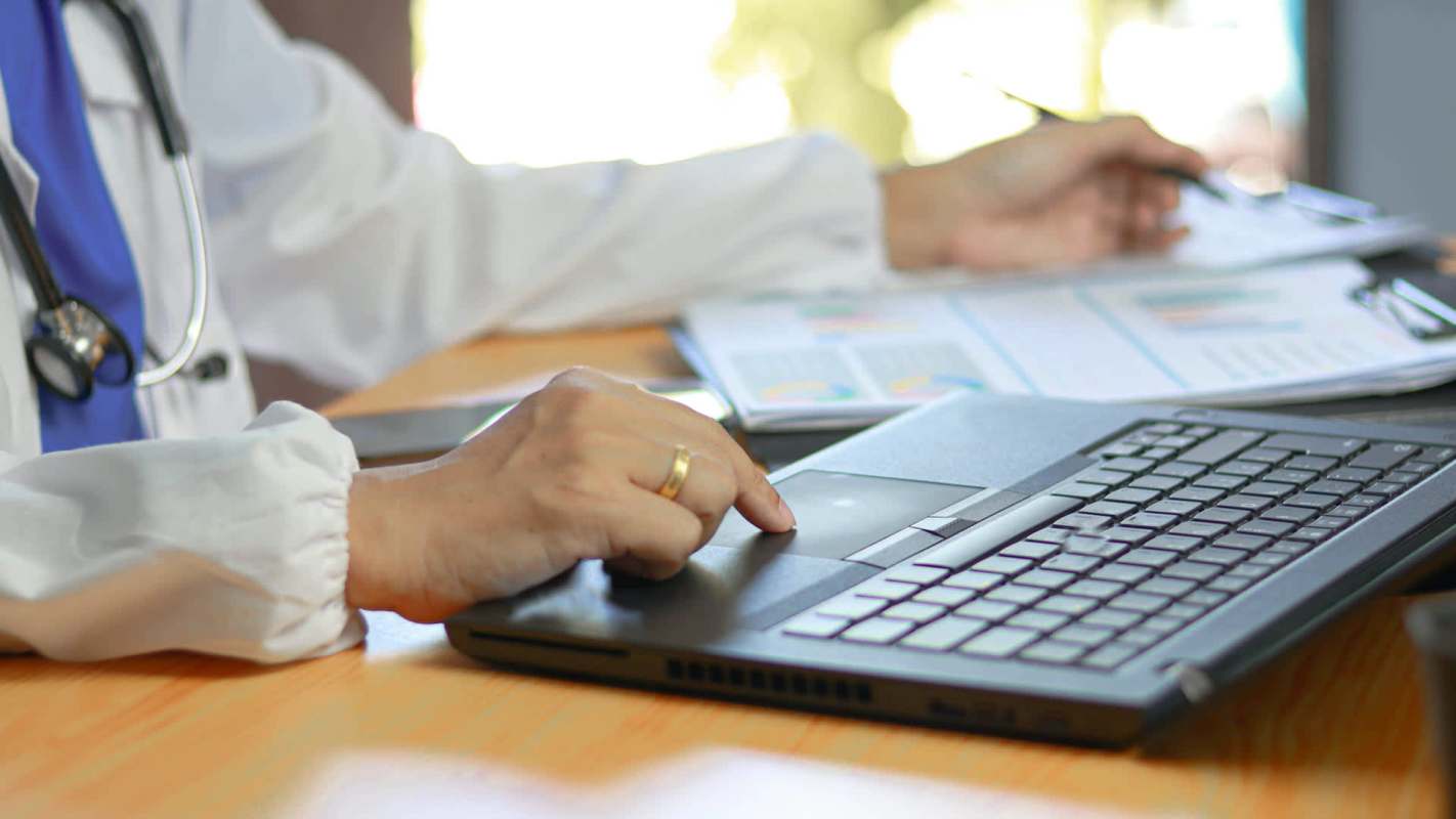 A person using a laptop.