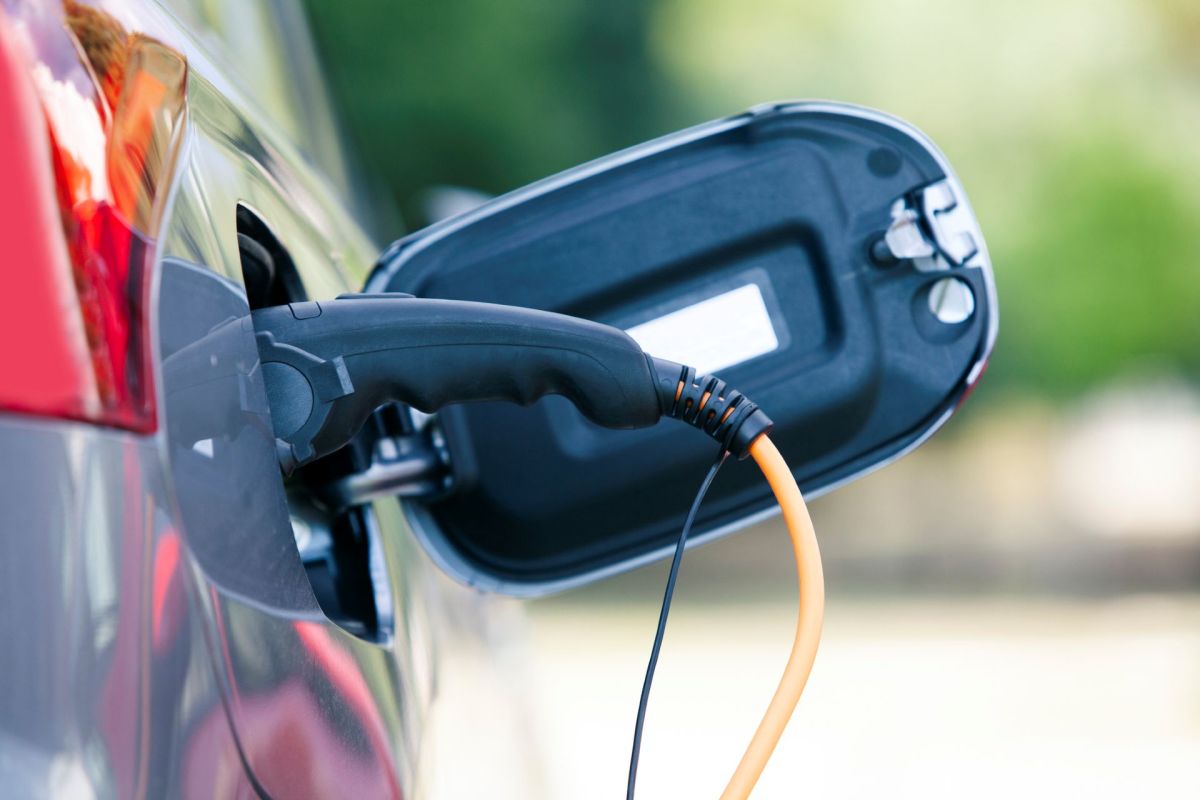 An electric vehicle plugged into a charging station.