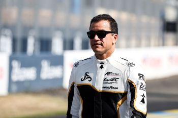 Francois Perrodo of France wears sunglasses and a car racing uniform