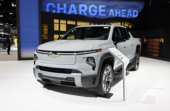 An electric pickup truck displayed at a automotive exhibition.