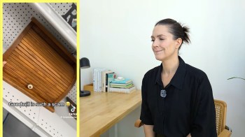 A bread box and a woman reviewing Goodwill.