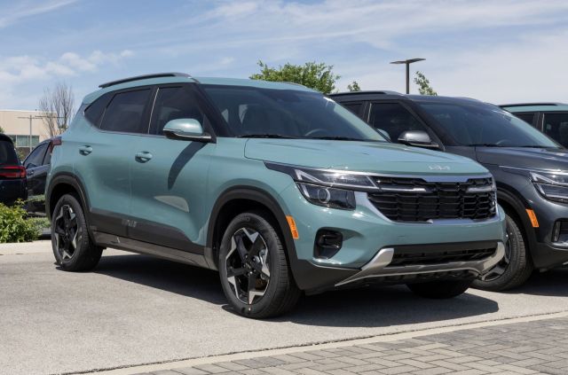 A Kia Seltos sits on a lot at a dealership