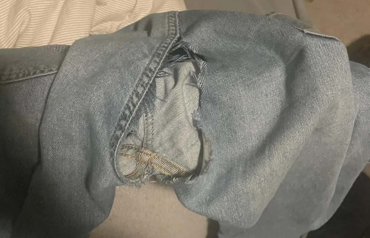 A pair of torn blue jeans.