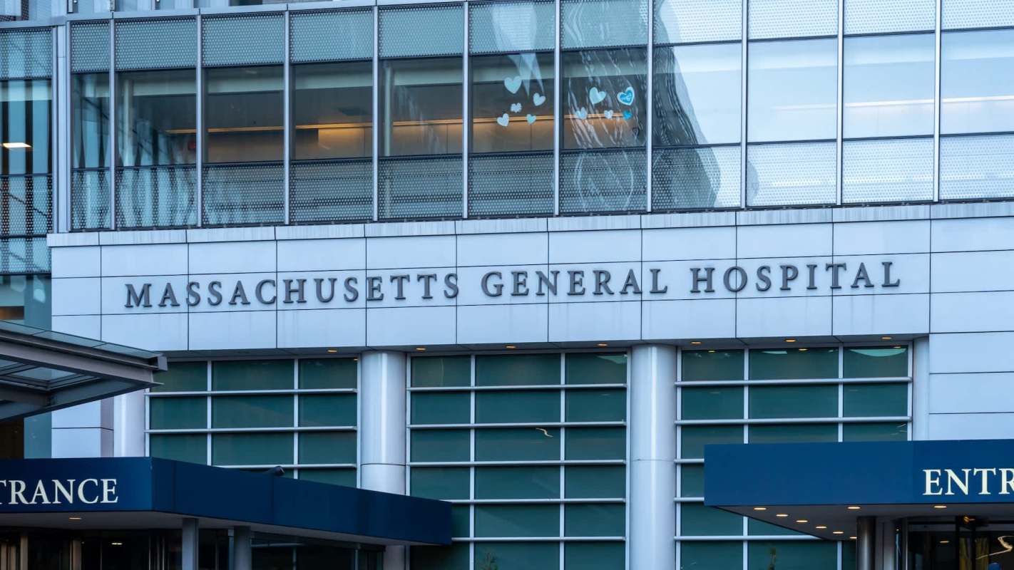 Massachusetts General Hospital sign on a modern building facade.