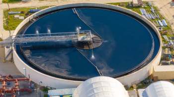 A large circular water treatment tank.