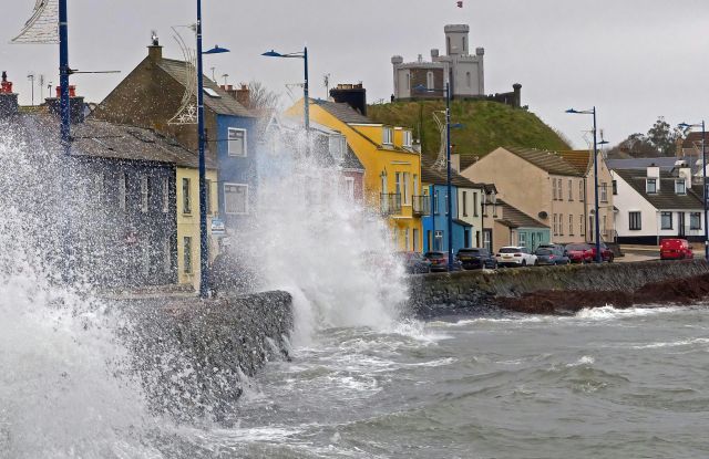 Waves crashing over a wall in Northern Ireland.