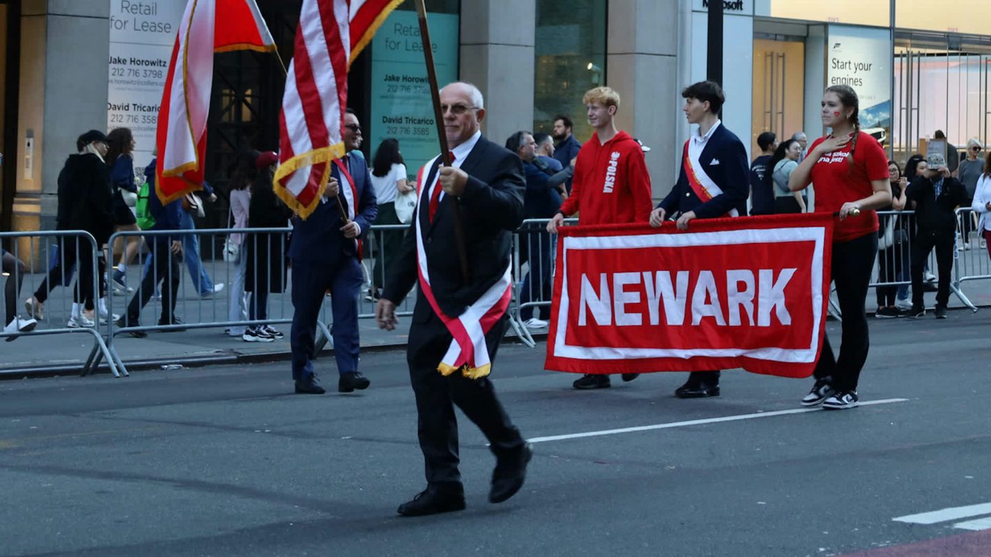 People marching in a parade in Newark.