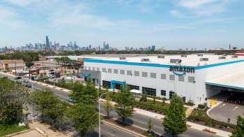 An Amazon warehouse with the Chicago skyline in the background.