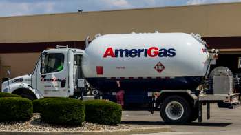 A propane delivery truck with AmeriGas branding parked in a commercial area.