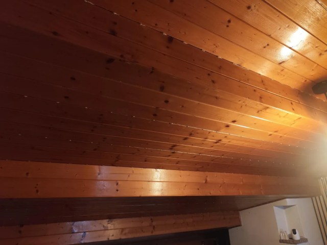 Wood paneling in an attic.
