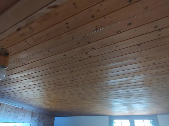 Wood paneling in an attic.