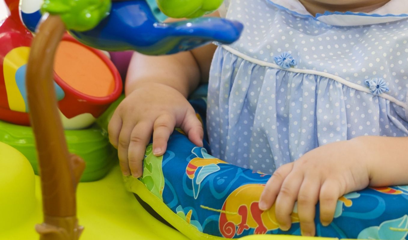A baby in a jumper toy.