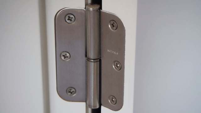 In the UK, a beginner homeowner fixed one hinge with toothpicks, then caught the DIY bug