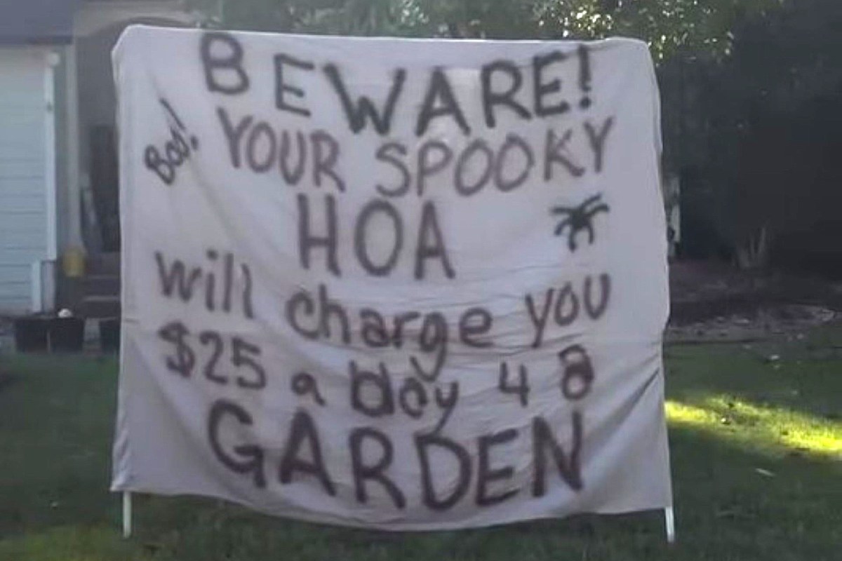 A Halloween sign warning about an HOA.