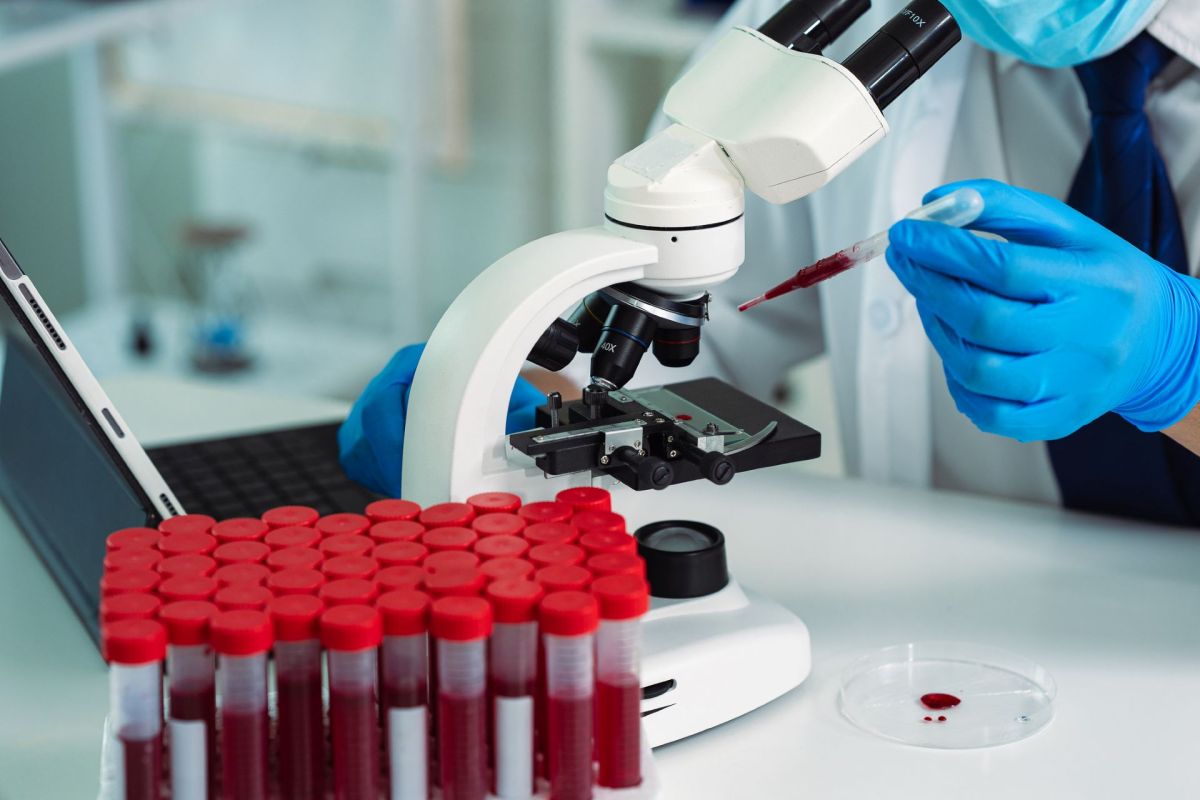 A researcher analyzing blood samples.