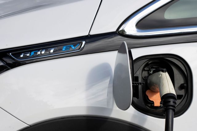 A charger plugged into a Chevy Bolt.