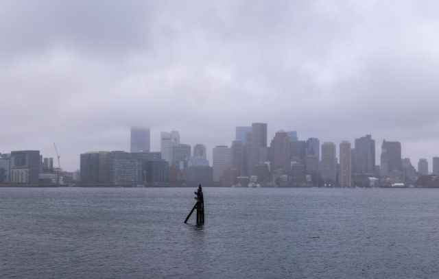 The Boston skyline over water.