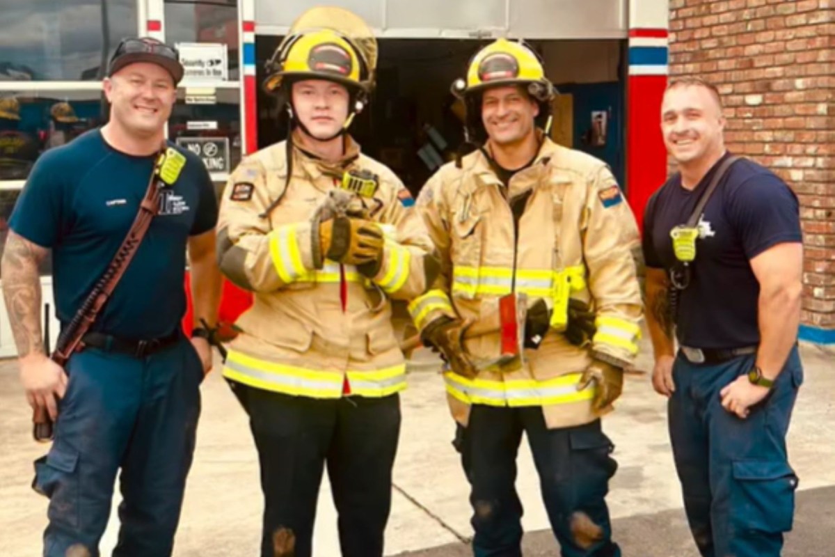 Tucson Fire Department firefighters holding the cat.