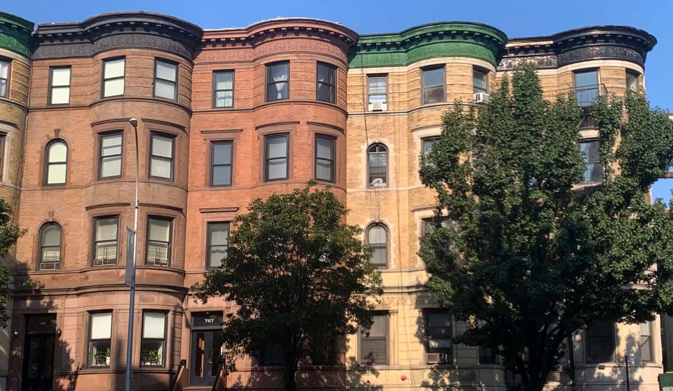 Historic brownstone buildings in New York City.