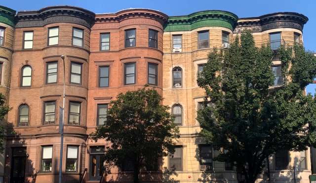 Historic brownstone buildings in New York City.