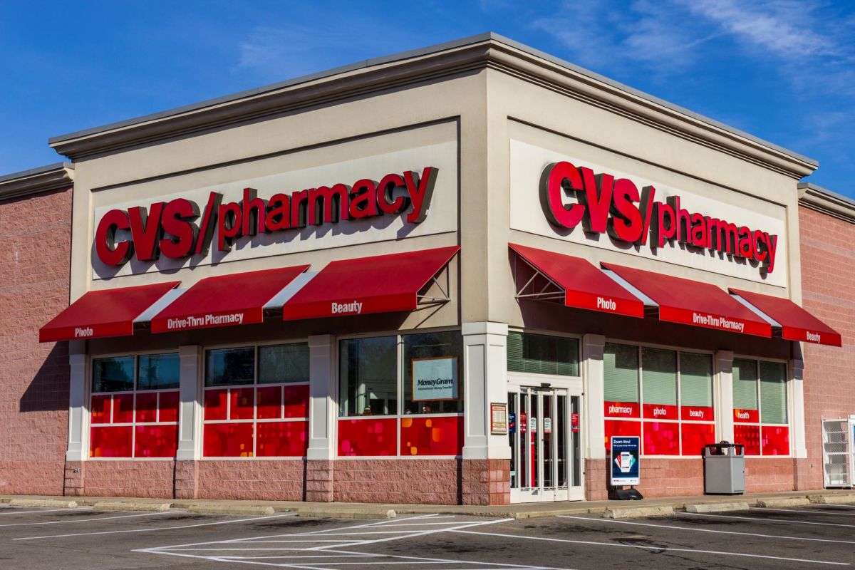 A CVS pharmacy building with red awnings and signage.