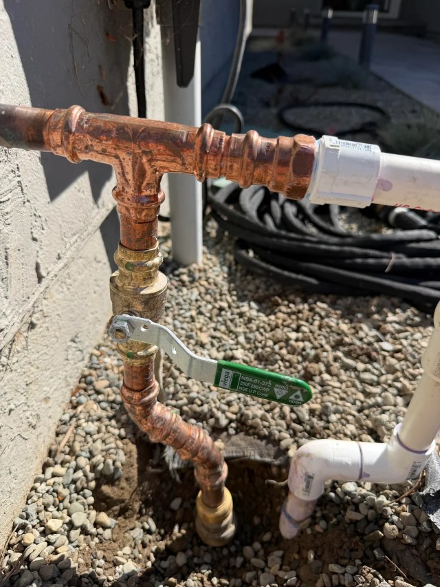 The shutoff tap on a pipe system.