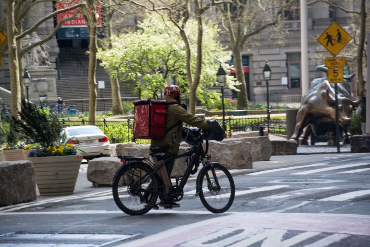 A person with an e-bike in New York City.