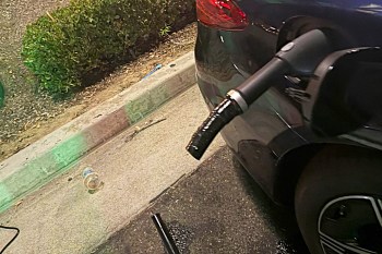 A charging cable stuck in an electric vehicle.