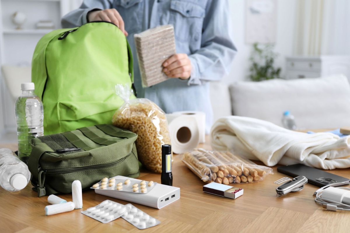 A person packing an emergency bag.