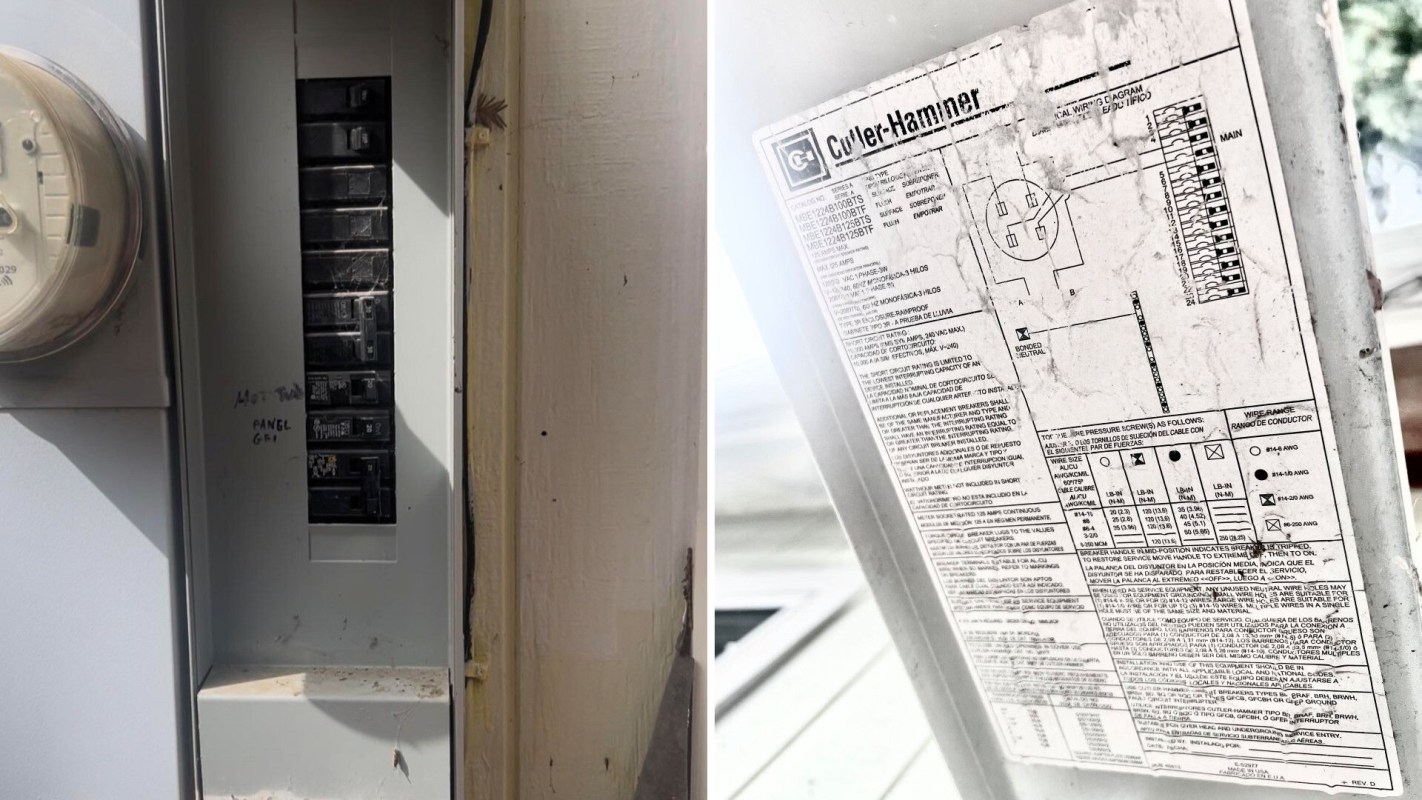 An electrical panel with circuit breakers and a specification label attached.