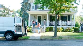 A family moving into a house.