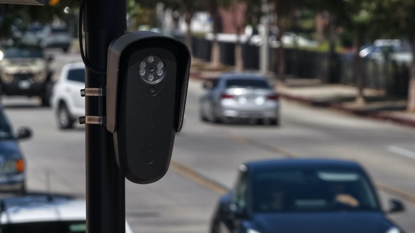 A surveillance camera on a pole.