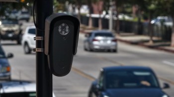 A surveillance camera on a pole.