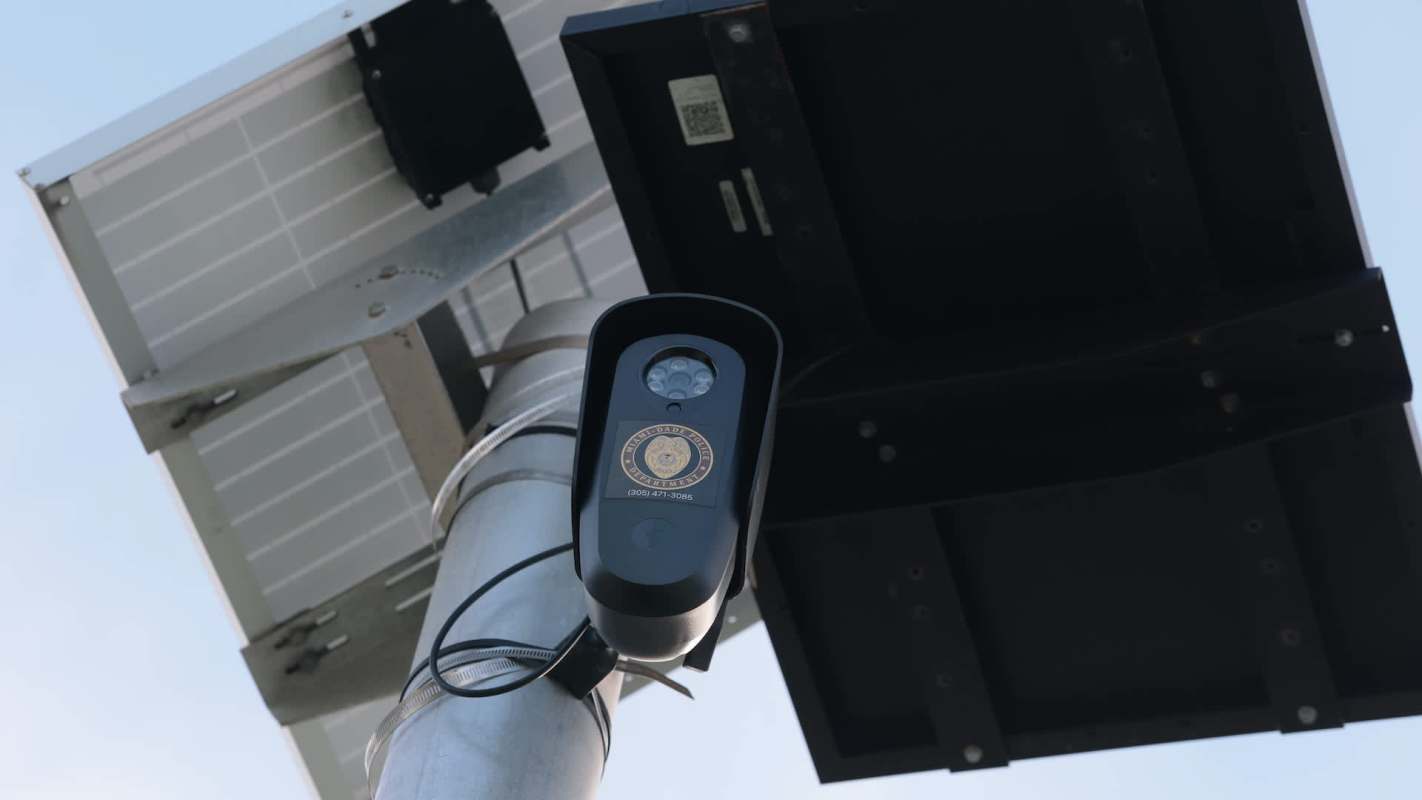 A surveillance camera mounted on a pole.