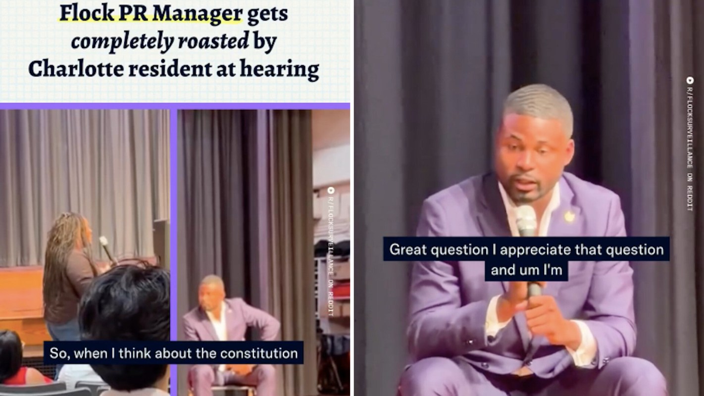 A woman speaking at a public hearing while a man listens and holds a microphone.