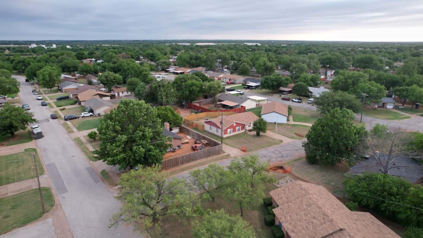 An aerial view of a suburban neighborhood in Wichita Falls, Texas, with houses and trees.